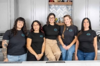 The Declutter My Clutter team smiling in kitchen
